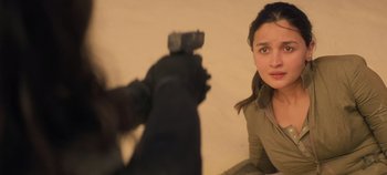 Movie still from “Heart of Stone” (2023), directed by Tom Harper – A woman taking a picture of herself in a mirror; Close Up shot, Over the shoulder angle