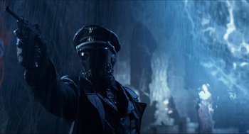 Movie still from “Hellboy” (2004), directed by Guillermo del Toro – A man in a military uniform standing in the rain; Close Up shot, Low angle