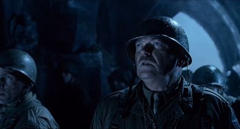 Movie still from “Hellboy” (2004), directed by Guillermo del Toro – A man in a military uniform wearing a helmet; Close Up shot, Low angle