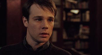 Movie still from “Hellboy” (2004), directed by Guillermo del Toro – A young man is looking into the distance; Close Up shot, High angle