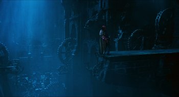 Movie still from “Hellboy” (2004), directed by Guillermo del Toro – A man sitting on top of a platform; Extreme Wide shot, Low angle
