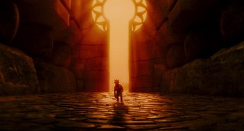 Movie still from “Hellboy II: The Golden Army” (2008), directed by Guillermo del Toro – A small toy character standing in front of an open door; Extreme Wide shot, High angle
