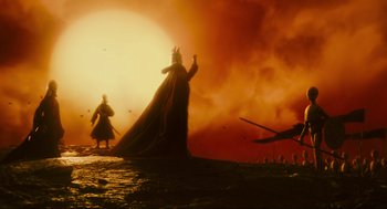 Movie still from “Hellboy II: The Golden Army” (2008), directed by Guillermo del Toro – Two people are standing in the middle of a field; Extreme Wide shot, Low angle