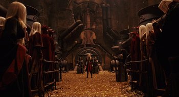 Movie still from “Hellboy II: The Golden Army” (2008), directed by Guillermo del Toro – A group of people standing in front of a building; Wide shot, High angle