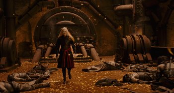 Movie still from “Hellboy II: The Golden Army” (2008), directed by Guillermo del Toro – A woman walking in a room filled with debris; Wide shot, High angle