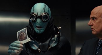 Movie still from “Hellboy II: The Golden Army” (2008), directed by Guillermo del Toro – A person with a mask and goggles on; Close Up shot, Over the shoulder angle