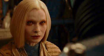 Movie still from “Hellboy II: The Golden Army” (2008), directed by Guillermo del Toro – A person with blonde hair; Close Up shot, Over the shoulder angle