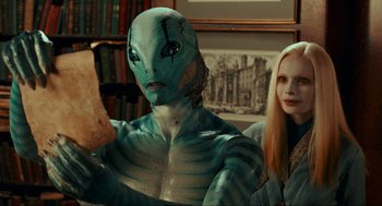 Movie still from “Hellboy II: The Golden Army” (2008), directed by Guillermo del Toro – A man and a woman are posing for a picture; Close Up shot, High angle