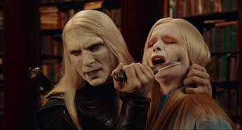 Movie still from “Hellboy II: The Golden Army” (2008), directed by Guillermo del Toro – A couple of people that are in a room; Close Up shot, Over the shoulder angle