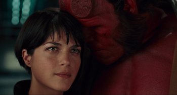 Movie still from “Hellboy II: The Golden Army” (2008), directed by Guillermo del Toro – A woman and a demon behind her face; Close Up shot, Overhead angle