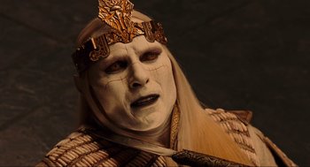 Movie still from “Hellboy II: The Golden Army” (2008), directed by Guillermo del Toro – A man with a long blonde hair wearing a crown; Close Up shot, Over the shoulder angle