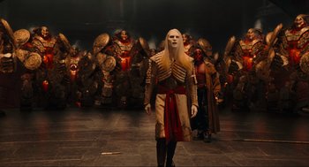 Movie still from “Hellboy II: The Golden Army” (2008), directed by Guillermo del Toro – A group of people dressed in costumes and masks; Wide shot, High angle