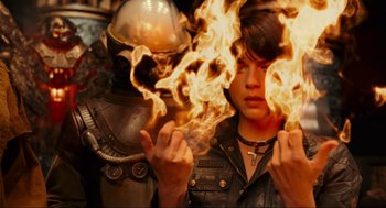 Movie still from “Hellboy II: The Golden Army” (2008), directed by Guillermo del Toro – A man in a leather jacket holding a fire bomb in front of a woman; Close Up shot, Overhead angle