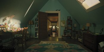 Movie still from “Hereditary” (2018), directed by Ari Aster – A bedroom with a bed , a bookshelf , and an open door; Wide shot, Overhead angle