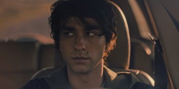 Movie still from “Hereditary” (2018), directed by Ari Aster – A person sitting in a car; Close Up shot, Over the shoulder angle