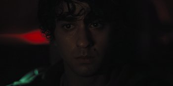 Movie still from “Hereditary” (2018), directed by Ari Aster – A person's face in the dark; Close Up shot, Low angle