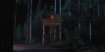 Movie still from “Hereditary” (2018), directed by Ari Aster – A tree house in the middle of the night; Extreme Wide shot, Low angle