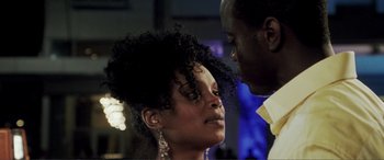 Movie still from “Hitch” (2005), directed by Andy Tennant – A man and a woman looking into each others eyes; Close Up shot, Low angle