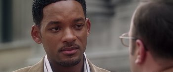 Movie still from “Hitch” (2005), directed by Andy Tennant – A person wearing a suit and tie; Close Up shot, Over the shoulder angle