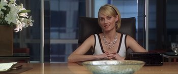 Movie still from “Hitch” (2005), directed by Andy Tennant – A woman sitting in front of a bowl on a table; Medium shot, Over the shoulder angle