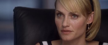 Movie still from “Hitch” (2005), directed by Andy Tennant – A woman's face in a black and white dress; Close Up shot, Over the shoulder angle