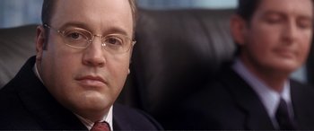 Movie still from “Hitch” (2005), directed by Andy Tennant – A person wearing a suit and tie; Close Up shot, Over the shoulder angle