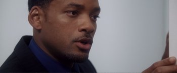Movie still from “Hitch” (2005), directed by Andy Tennant – A man's face with his mouth wide open; Close Up shot, Over the shoulder angle