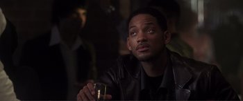 Movie still from “Hitch” (2005), directed by Andy Tennant – A person holding a glass of wine; Close Up shot, Over the shoulder angle