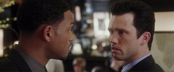 Movie still from “Hitch” (2005), directed by Andy Tennant – Two men face each other in a restaurant; Close Up shot, Over the shoulder angle