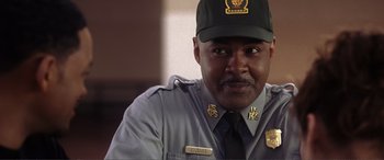 Movie still from “Hitch” (2005), directed by Andy Tennant – A person wearing a uniform and wearing a hat; Close Up shot, Low angle