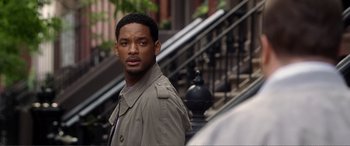 Movie still from “Hitch” (2005), directed by Andy Tennant – A man standing on the side of a building; Close Up shot, Over the shoulder angle