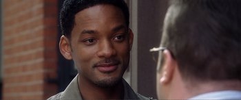 Movie still from “Hitch” (2005), directed by Andy Tennant – A person with a cell phone; Close Up shot, Over the shoulder angle