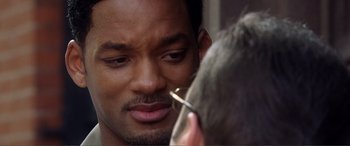 Movie still from “Hitch” (2005), directed by Andy Tennant – A person with a mirror; Close Up shot, Over the shoulder angle