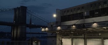 Movie still from “Hitch” (2005), directed by Andy Tennant – A building that has some lights in it; Extreme Wide shot, Low angle
