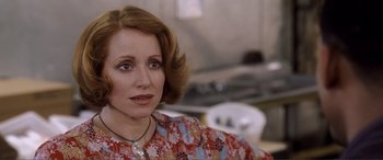 Movie still from “Hitch” (2005), directed by Andy Tennant – A person wearing a necklace; Close Up shot, Over the shoulder angle