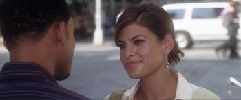 Movie still from “Hitch” (2005), directed by Andy Tennant – A person with a smile on their face; Close Up shot, Over the shoulder angle