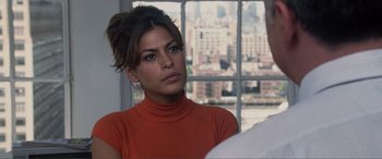 Movie still from “Hitch” (2005), directed by Andy Tennant – A woman in a red shirt looking out of a window; Close Up shot, Over the shoulder angle