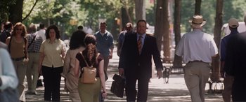 Movie still from “Hitch” (2005), directed by Andy Tennant – A group of people walking down a sidewalk; Medium shot, Over the shoulder angle