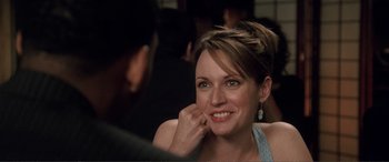 Movie still from “Hitch” (2005), directed by Andy Tennant – A person sitting in front of a camera; Close Up shot, Over the shoulder angle