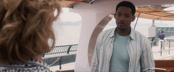 Movie still from “Hitch” (2005), directed by Andy Tennant – A man and a woman on a boat in front of the water; Close Up shot, Over the shoulder angle