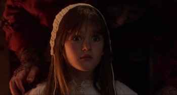 Movie still from “Hocus Pocus” (1993), directed by Kenny Ortega – A little girl wearing a white dress and a white hat; Close Up shot, Low angle