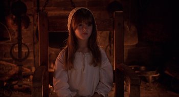 Movie still from “Hocus Pocus” (1993), directed by Kenny Ortega – A young girl wearing a white dress and a white hat; Close Up shot, High angle