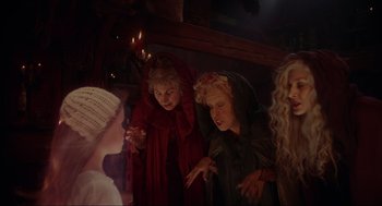 Movie still from “Hocus Pocus” (1993), directed by Kenny Ortega – A group of people dressed up in costumes; Medium shot, Over the shoulder angle