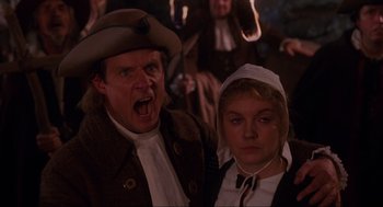 Movie still from “Hocus Pocus” (1993), directed by Kenny Ortega – A man and a woman dressed in costume; Medium shot, Over the shoulder angle