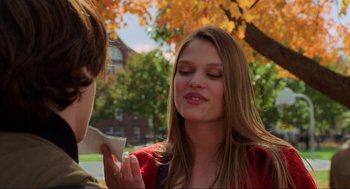 Movie still from “Hocus Pocus” (1993), directed by Kenny Ortega – A young woman holding a piece of paper in front of her face; Close Up shot, Over the shoulder angle