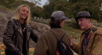 Movie still from “Hocus Pocus” (1993), directed by Kenny Ortega – A group of people standing next to each other on a field; Medium shot, Over the shoulder angle