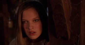 Movie still from “Hocus Pocus” (1993), directed by Kenny Ortega – A young woman with long brown hair wearing a hooded jacket; Close Up shot, Low angle