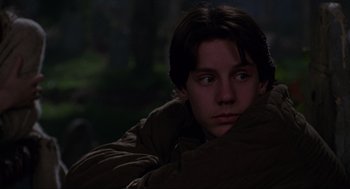 Movie still from “Hocus Pocus” (1993), directed by Kenny Ortega – A young man is sitting in the dark with his eyes closed; Close Up shot, Low angle