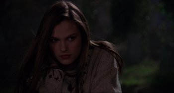 Movie still from “Hocus Pocus” (1993), directed by Kenny Ortega – A woman with long brown hair wearing a white shirt; Close Up shot, Over the shoulder angle