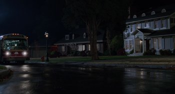 Movie still from “Hocus Pocus” (1993), directed by Kenny Ortega – A street light on the side of the road near a house; Extreme Wide shot, Low angle